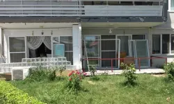 Bursa'da 20 santimetrelik balkon çıkıntısı için kepçeli yıkım!
